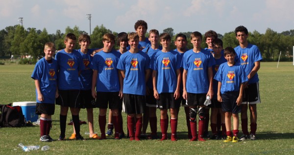 CHS_Boys_Soccer_showing_off_champ_t-shirts
